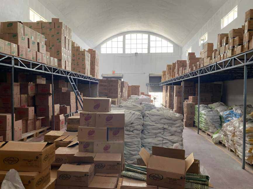 Warehouse floor, stock racked to the roofline